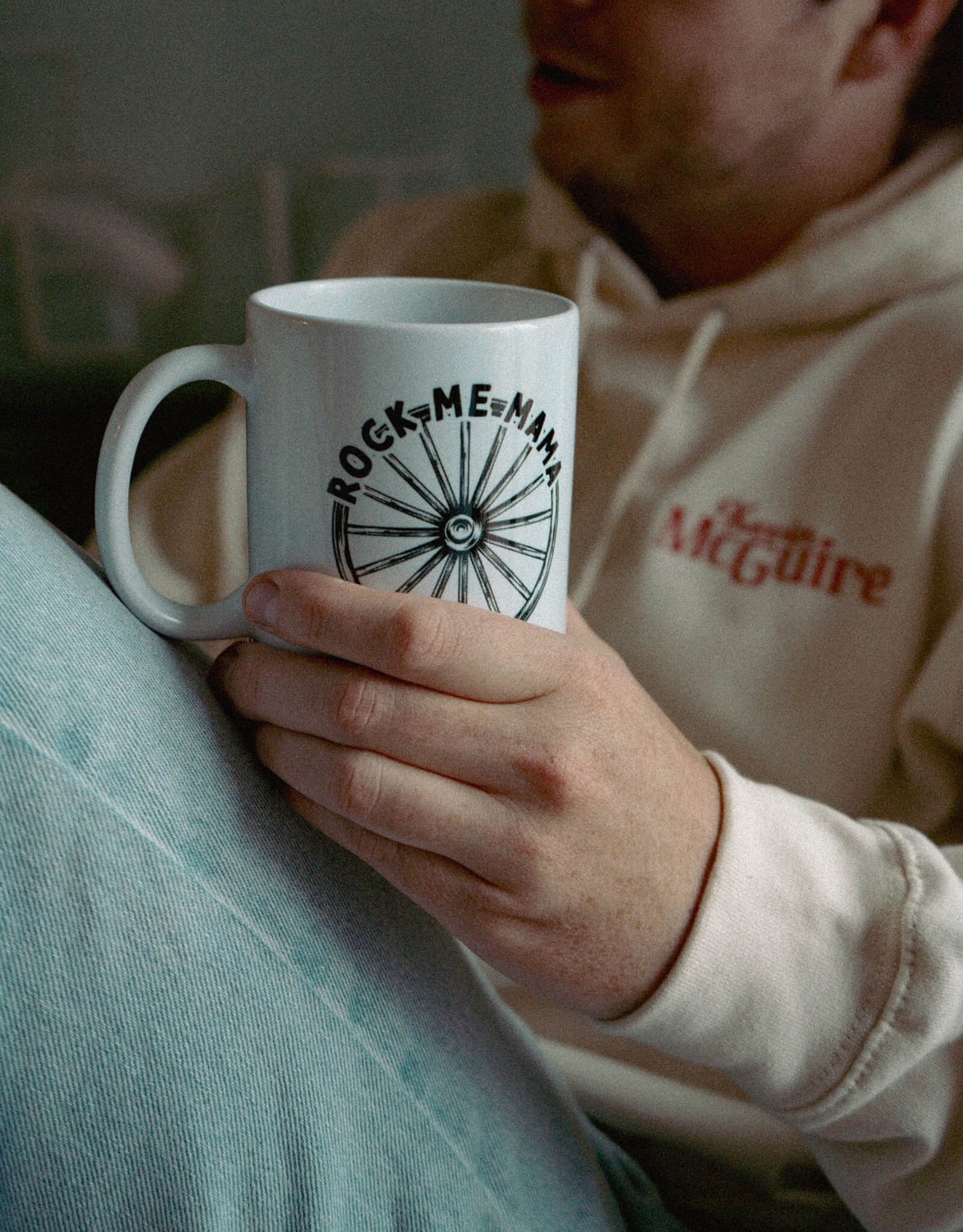 Kevin McGuire holding his Rock Me Mama Ceramic Mug